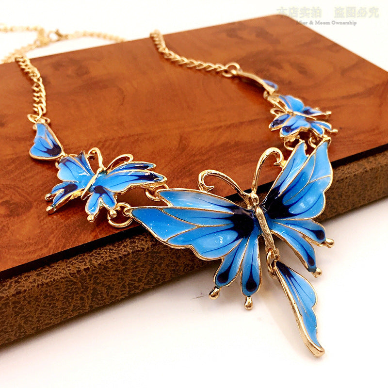 Butterfly Drop Oil Necklace and Earring Set | Nature-Inspired Jewelry Ensemble.