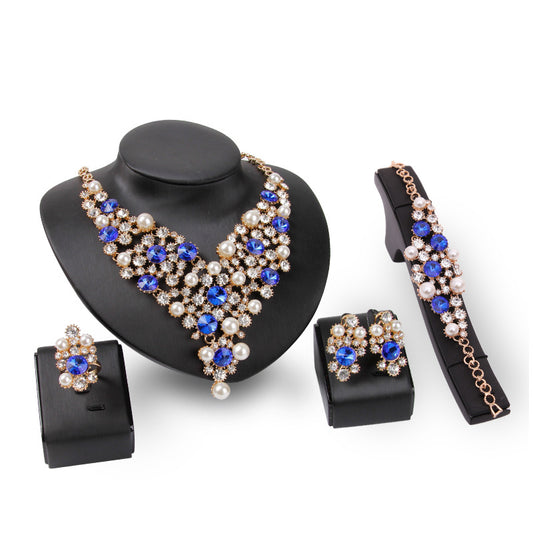 Elegant Four-Piece Bridal Jewelry Set: Necklace and Earrings.